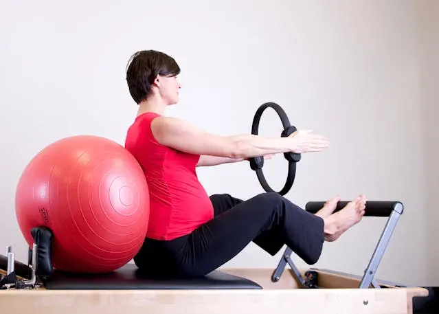 woman doing machine pilates