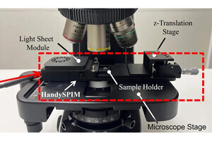 日本電気硝子など、顕微鏡ステージに搭載できる光シート顕微鏡光源を開発
