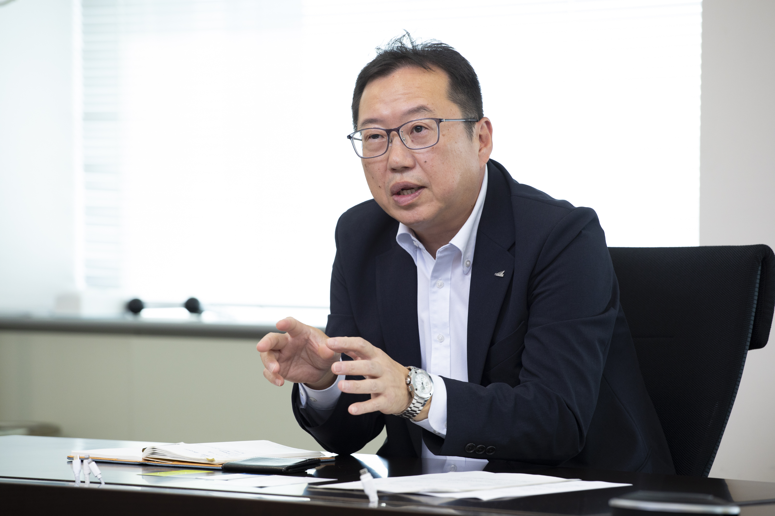 （写真）新日本空調株式会社 執行役員　 管理本部 副本部長 兼 新システムプロジェクト室長 上田 和弘 氏