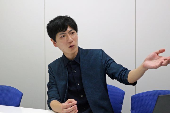 写真：石油資源開発株式会社 経営企画本部経営企画部 基幹システムグループ 内田優氏の顔写真