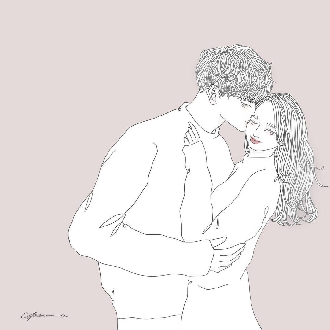 彼女の頬にキスする男性